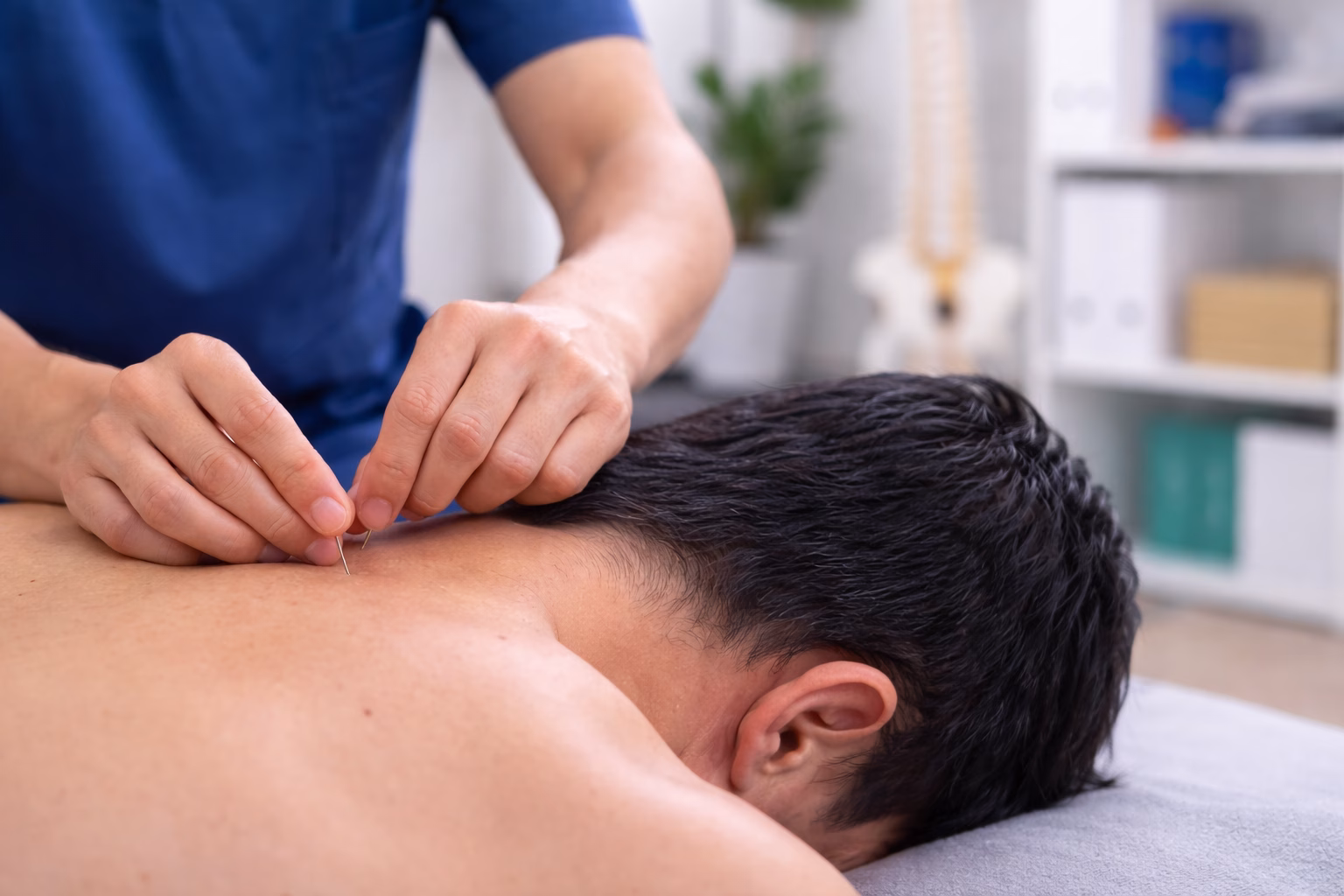 Physiotherapist performing dry needling treatment